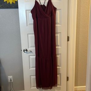 Maroon floor length dress.